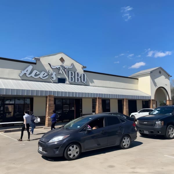 Ace's BBQ restaurant exterior with cars in the parking lot and people walking near the entrance.